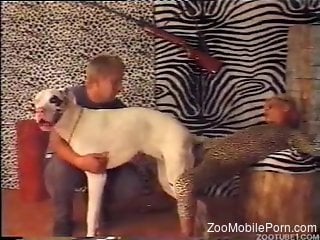 Leopard print hottie is about to fuck a kinky dog